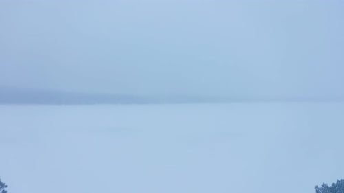 The beautiful blue misty magical landscape of Lapland, Finland - aerial descend