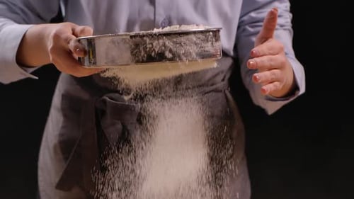 Baker Sifts Flour Using Sieve Preparation for Baking