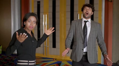 Woman and Man Arguing in Movie Theatre Lobby
