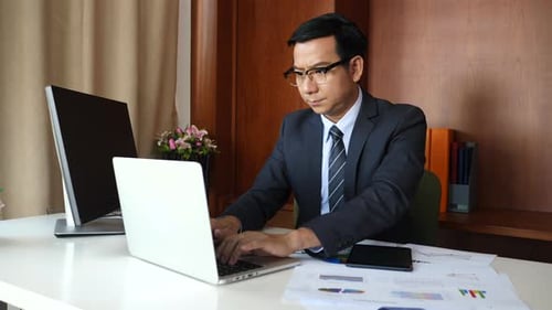 Businessman doing analysis planning business project in office.