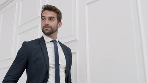 Businessman Walking And Checking Time