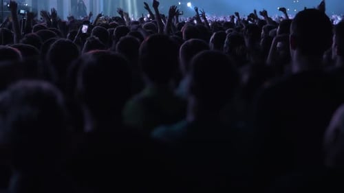 Band performing in crowded music hall