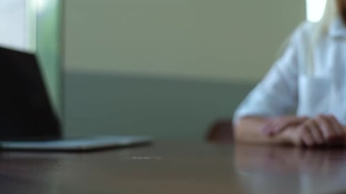 Closeup Side View of Unrecognizable Businesswoman and Businessman Closing Deal and Shaking Hands in