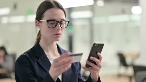 Young Woman Makes Online Payment on Mobile Phone
