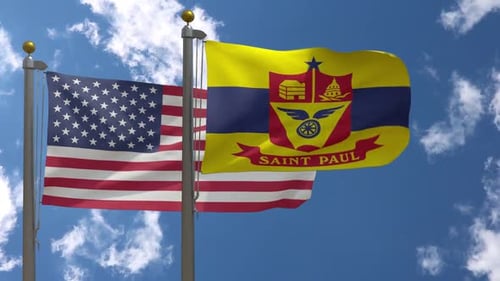 United States and Saint Paul City Flags Waving Against Blue Sky