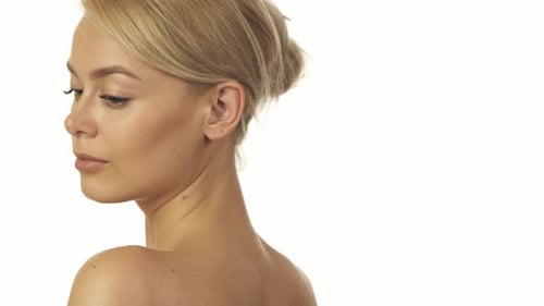 Woman with Blond Hair Turns and Smiles