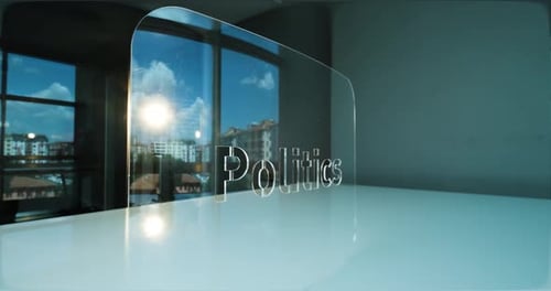 Glass Politics Letters and Office in Background