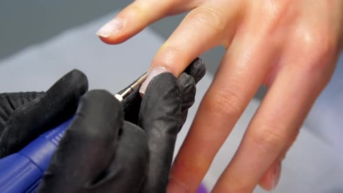 Skilled Manicurist Removes Cuticle with Milling Cutter