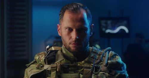 Stern Soldier in Tactical Gear Looks Intensely