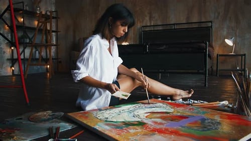 Woman Painting Abstract Art in Home Studio