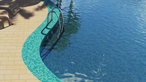 Piscina con tumbonas junto al mar.