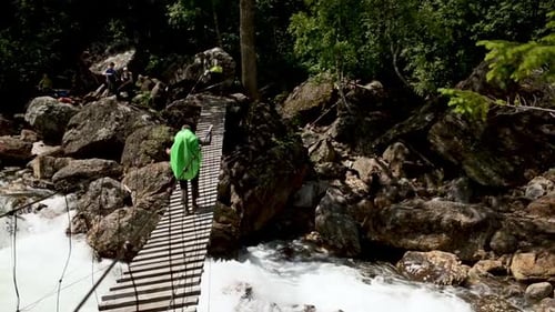 Hiker Person Crawling Walking on Rope Bridge Iroi