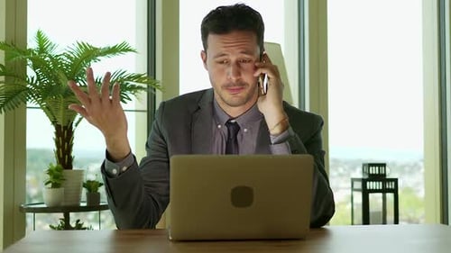 Young Handsome Businessman Working in Modern Office