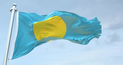Realistic Palau National Flag Waving in Blue Sky