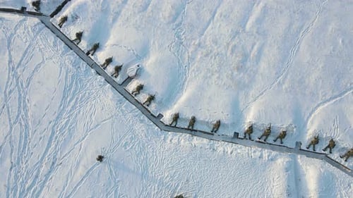 Uniformed People in Trench in Snowy Environment