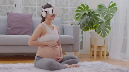 Pregnant Woman Using VR Headset, Meditating at Home