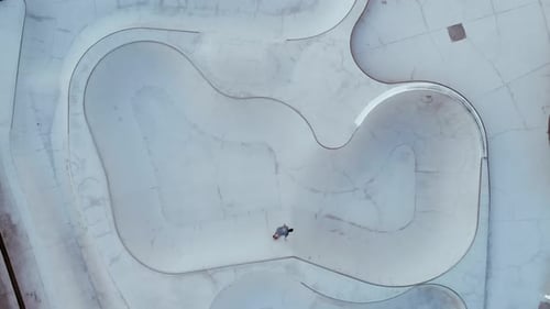 Drone Shot of Professional Skater Ride in Pool