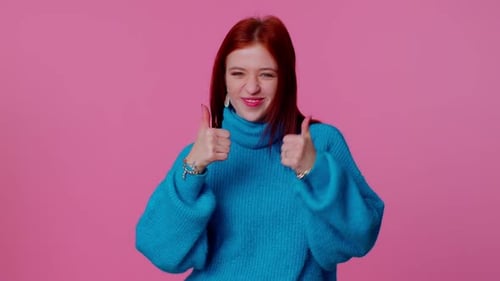 Happy Redhead Woman Gives Thumbs Up Approval