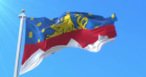 Realistic Waving Flag with Lion Crest Against Blue Sky