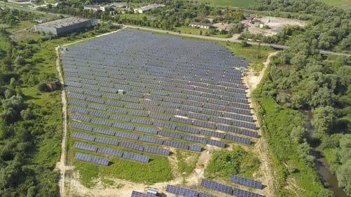 Aerial view of solar power plant field. Electrical photovoltaic panels for producing clean ecologic