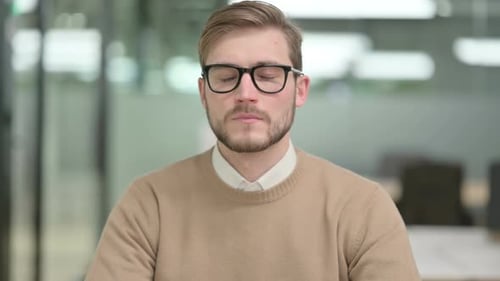 Man Wearing Glasses Looking Directly at Camera