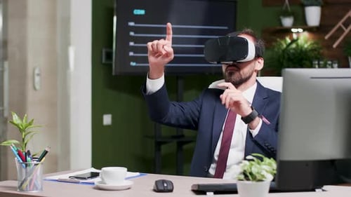 Dolly Shot of Office Worker Reading Sales Data Unsing a Virtual Reality Headset