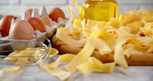 Fresh Pasta Ingredients Arranged on a Wooden Board