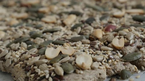 Close Up of Seeded Flatbread on Parchment Paper