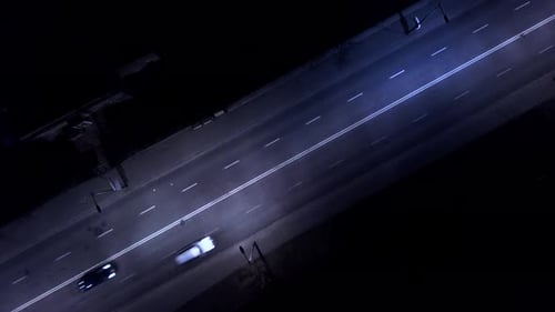 Aerial shot of the cars, on the road at night. Aerial footage. An amazing aerial view of the road st