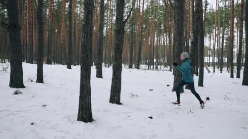 Runner Trains on Snowy Road