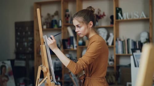 Female Artist Painting in an Art Studio