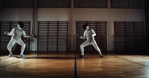 Fencers Thrusting And Parrying At Each Other With Their Foils