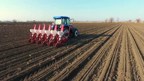 Blue Tractor Drilling Field