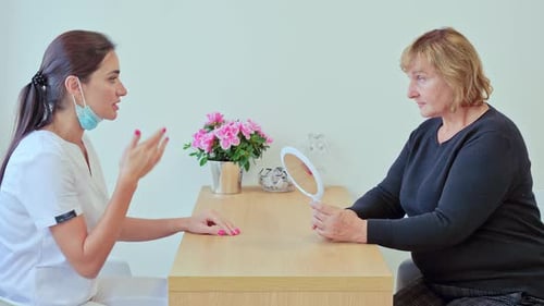 Mature Woman Consults with Doctor About Cosmetic Procedures