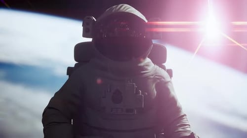 Space Man Astronaut in Space on a Background of the Blue Planet Earth