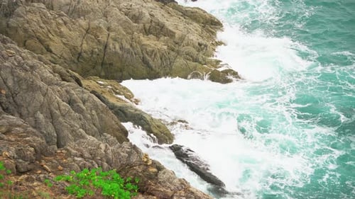 Sea Waves Break on The Stone Shore. Sea Breeze and Spray