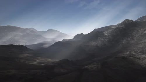 Sun Rays Against the Backdrop of the Mountains