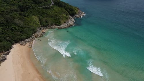 Aerial view of white sand beach and ocean wave