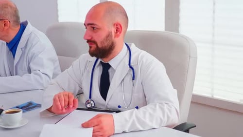 Close Up of Healthcare Physician Checking Notes on Clipboard