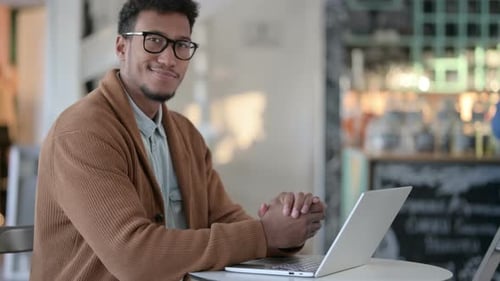 African Man Laptop Looking Camera Cafe