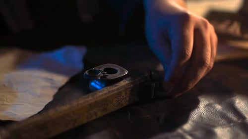 Loading a Flintlock Pistol in Moody Lighting