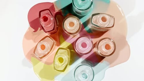 Pastel Nail Polish Bottles with Color Splatters