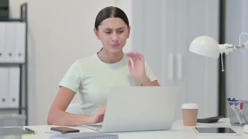 Woman with Neck Pain Works at Computer