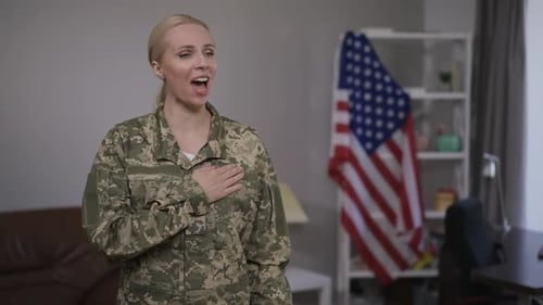 Blonde Woman Soldier Pledges Allegiance in Living Room