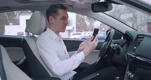 Young Man Video Calling in Parked Car