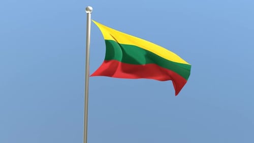Lithuanian Flag Waving on a Pole Against Blue Sky