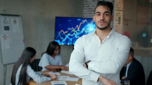 Young Middle Eastern Man White Collar Worker Smiling to Camera Posing with Crossed Hands in Office