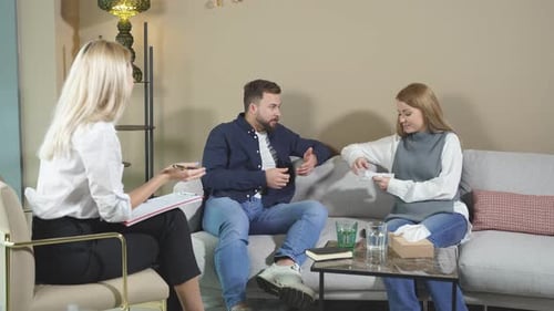 Young Married Couple Talking to Marriage Counselor Before Breaking Up Consulting Family