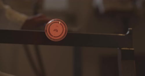 Professional glassblower working with glass at the workshop