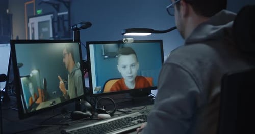 Man Telecommunicates with Young Adults During Virtual Meeting